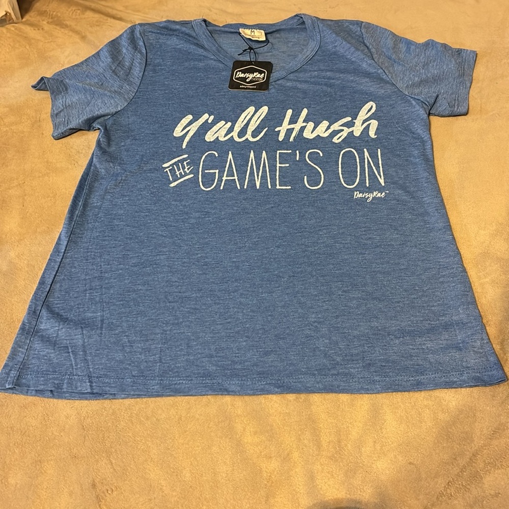DAISY RAE BLUE RAE WITH WHITE WRITTING Y’all Hush THE GAME’S ON SIZE MED